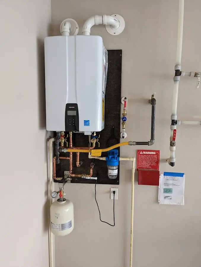 Professional plumber installing copper piping in a Wichita Falls home